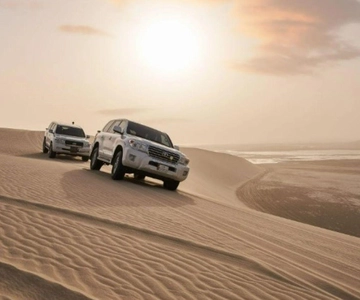 Doha : Inland Sea Desert Safari ,Camel Ride & Sandboarding