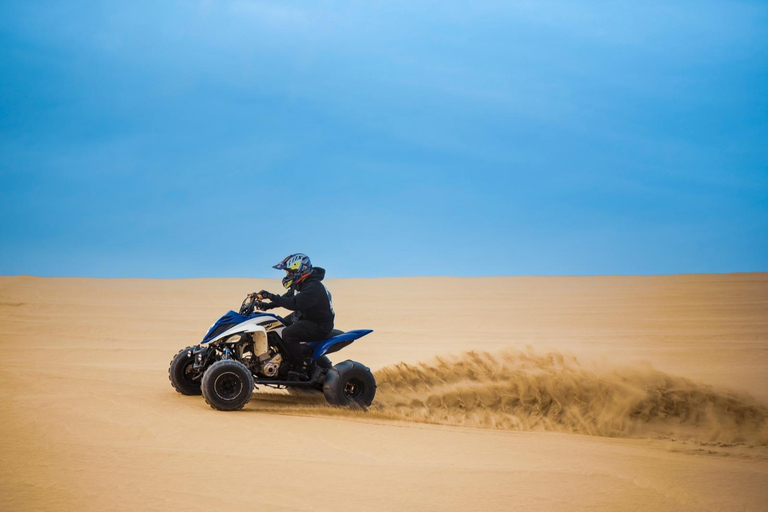 Doha: Arabic Costume, Desert Safari, Sandboarding & More Group Tour with Camel Ride in traditional Arabic Costume