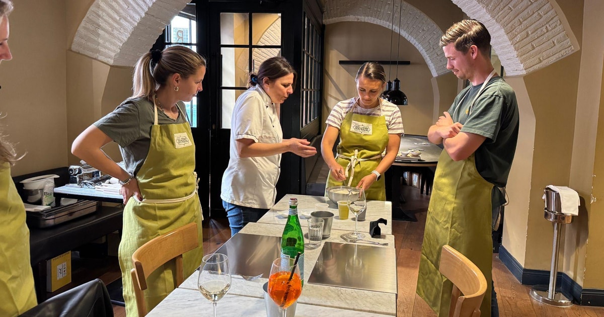 Rome mystery cooking class party with aperol spritz getyourguide