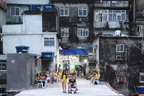 Motorcycle tour plus drone video in Rocinha with capoeira