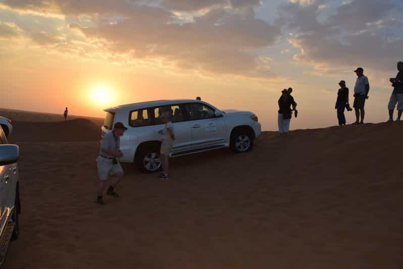 Dubai Red Dune Safari Camel Ride Sandboarding And Dinner GetYourGuide