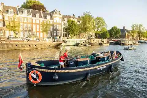 Amsterdam: Rejs otwartą łodzią po kanałach z przewodnikiem i napojami