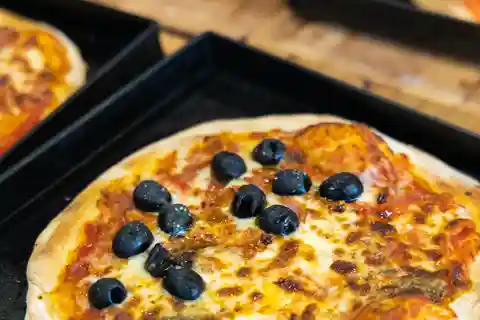 Roma: Clase de cocina de pizza y tiramisú con comida y bebida