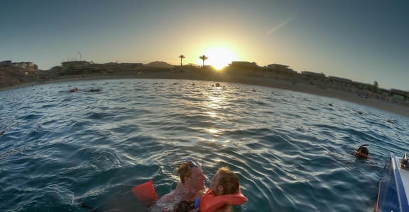 Los Cabos SL: Sunset Sailing Tour with Snorkeling, Buffet, and Open Bar