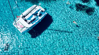 Tour Tourn, meio dia de catamarã para La Pelosa com Aperitif - Housity