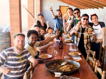 From Sitges: Paella Masterclass with Drink and Bike Ride