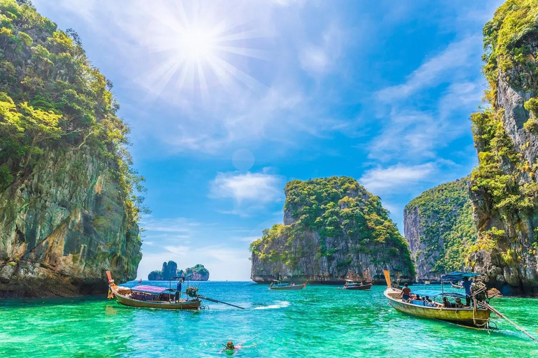 From Phi Phi: Full day Phi Phi Island tour by speed boat.