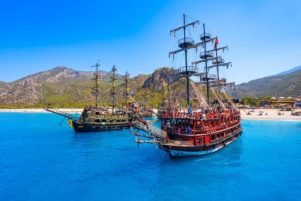 Family excursion boat floating in a sheltered turquoise bay near Bodrum