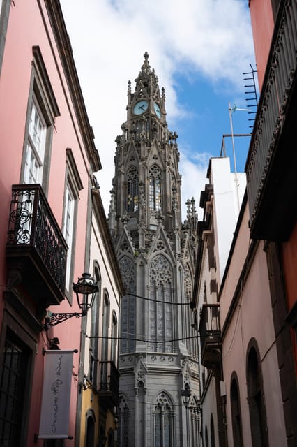 San Juan Bautista church rising above a narrow street in Arucas