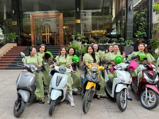 Saigon: Night Sights & Local Food Tour w Ao Dai Rider Option