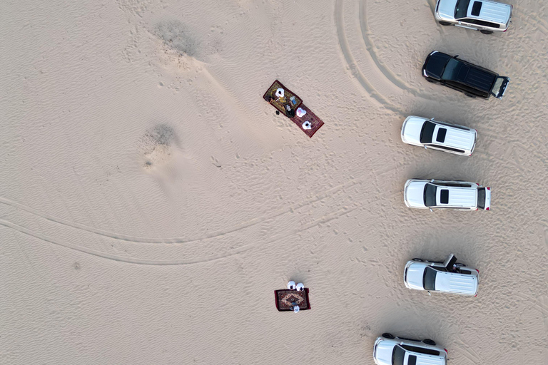 Qatar : Safari dans le désert au coucher du soleil avec promenade à dos de chameau et planche à sable.Visite privée