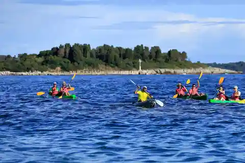 Pula: Three Island Kayak Tour with Cave Photo & Snorkeling