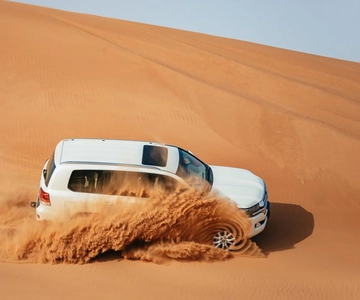 Dubaï : Safari dans le désert en jeep, balade à dos de chameau et excursion en quadricycle