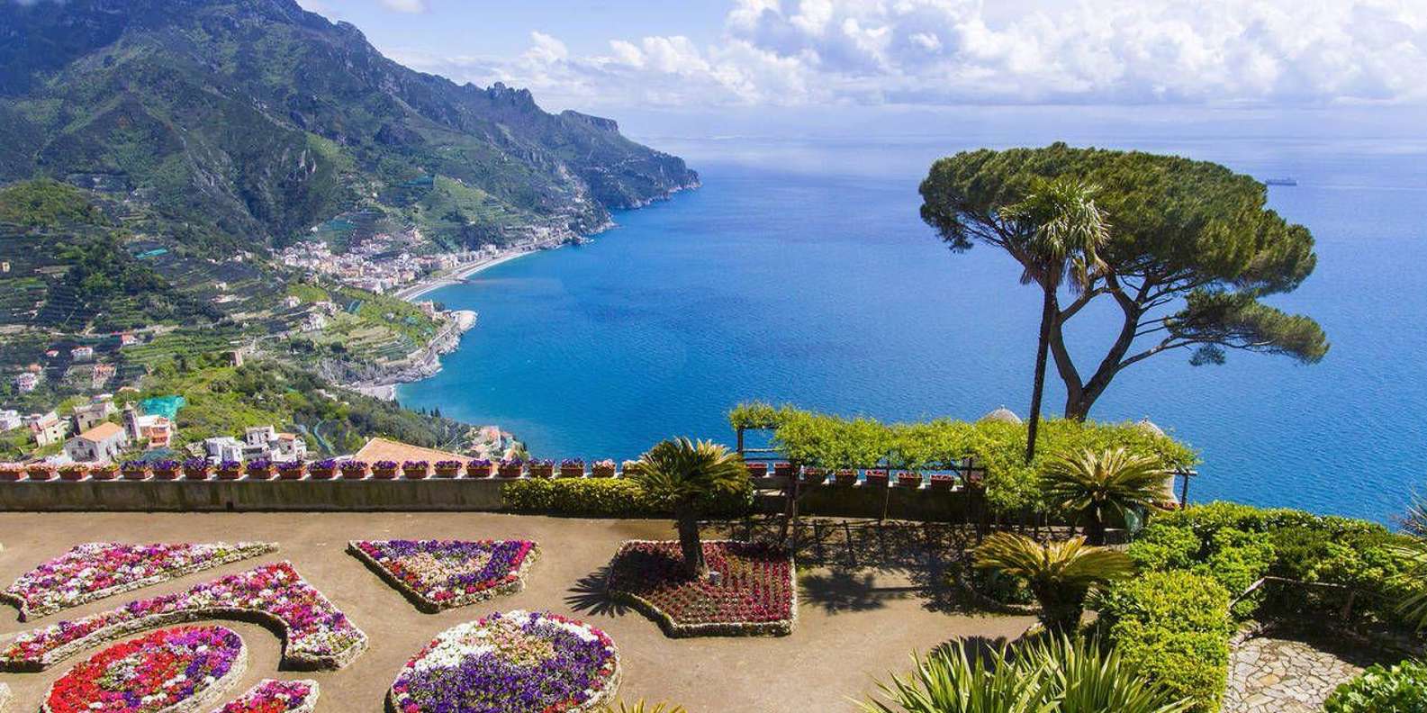 Minibus tour group on the winding Amalfi Coast road from Naples
