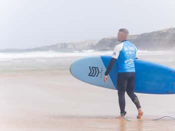 Surfboard rental + wetsuit + 1 surf lesson