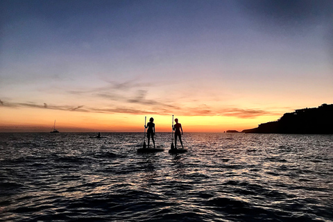 Paddelsurf i solnedgången, grottor, snorkling och cava