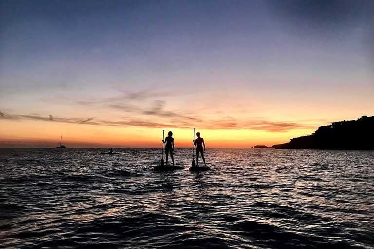 Paddelsurf i solnedgången, grottor, snorkling och cava