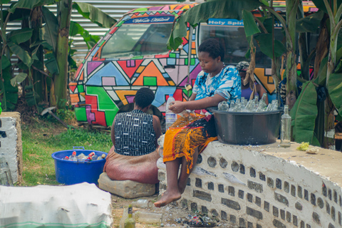 Kampala: Glassblowing, Beadmaking, and More Art Experience Blowing Glass Bubbles