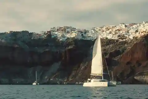 Santorini Gold Catamaran Cruise with Snorkel, BBQ & Open Bar