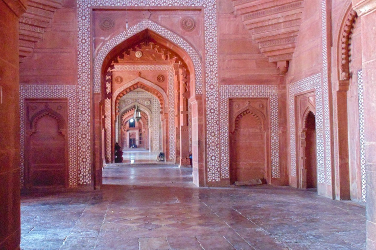 From Delhi: Sunrise Taj Mahal & Agra Fort Day Trip by AC Car Tour Guide Services Only