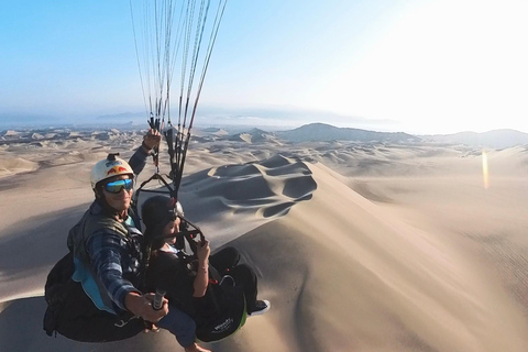 Paraglide over the desert and the Huacachina oasis