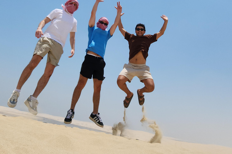 Doha: inland sea Tour With Dune Bashing &Sandboarding fun Doha: safari , camel ride, sandboarding hotel pickup