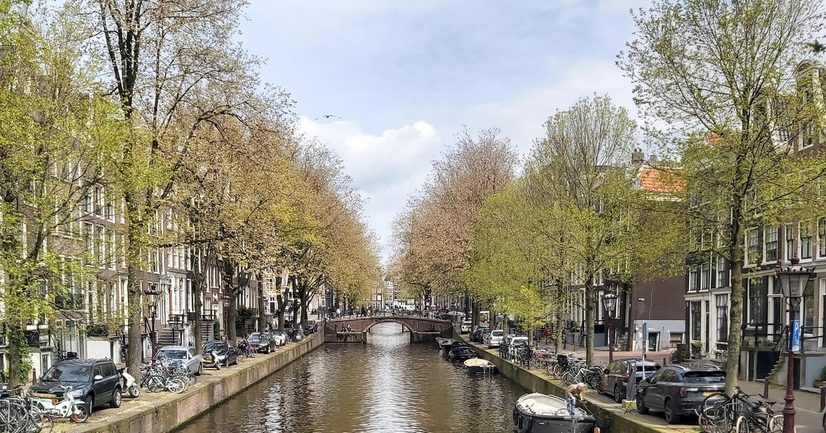 Local boat tour by the most beautiful canals of Amsterdam | GetYourGuide