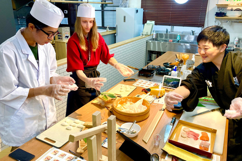 Nigiri-zushi making and soy sauce squeezing sushi