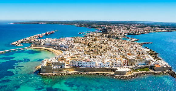 Aerial view of Gallipoli's old town on its small island, ringed by walls and turquoise sea