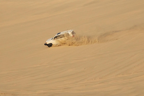 Safari dans le désert, promenade à dos de chameau, planche à sable et excursion en mer intérieureSafari, Dune Bashing, Camel Ride, Sandboard & Inland sea tour