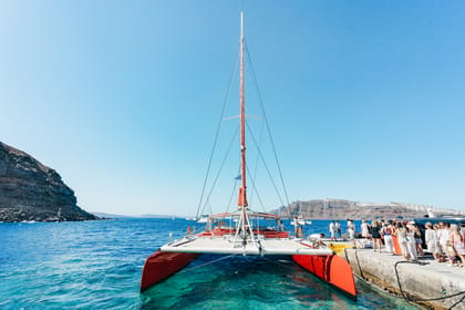 Santorini: Catamaran Tour with BBQ Dinner, Drinks, and Music | GetYourGuide