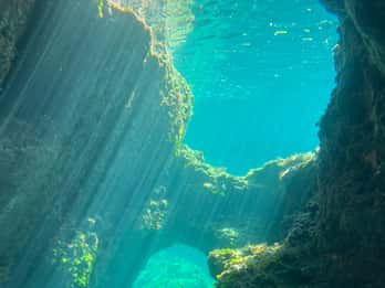 Alcudia: día y puesta de sol, cuevas marinas y aventura en barco con snorkel