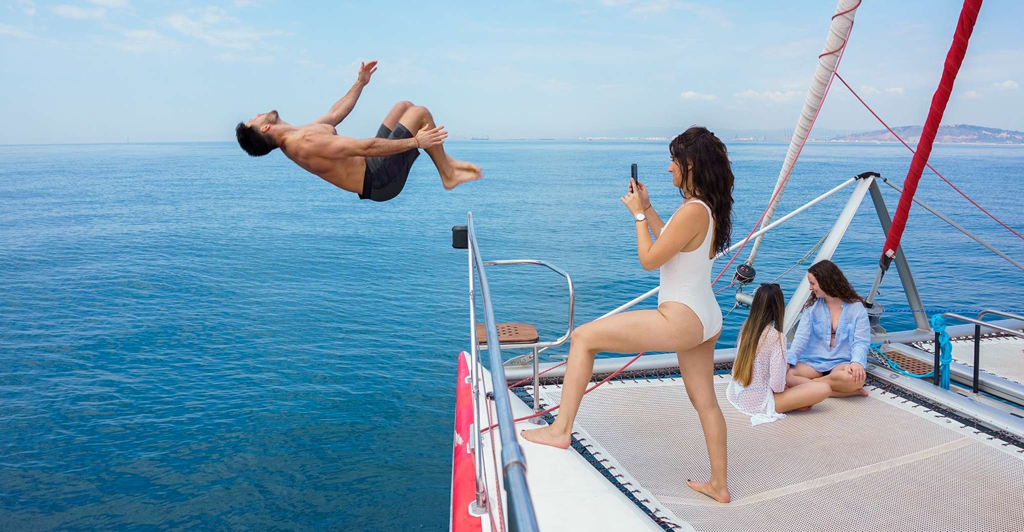 Barcelona: Sunset or Day Catamaran Cruise with Tapa & Drink photo 4