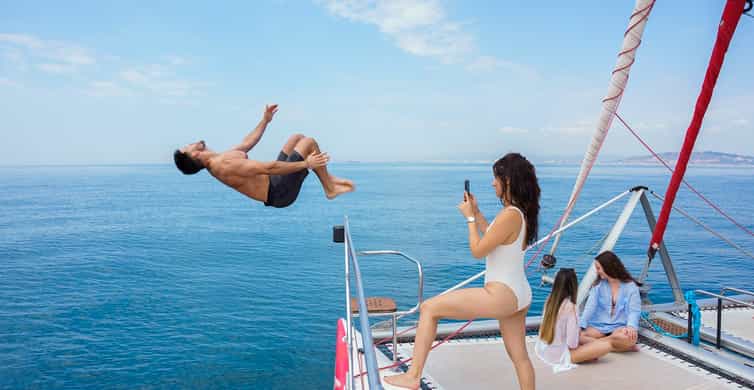 Barcelona: Sunset or Day Catamaran Cruise with Tapa & Drink photo 4
