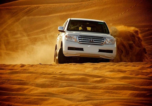 Visit Desert Safari Dubai, Camel Ride, Sandboard, BBQ & Live Shows in Abu Dhabi