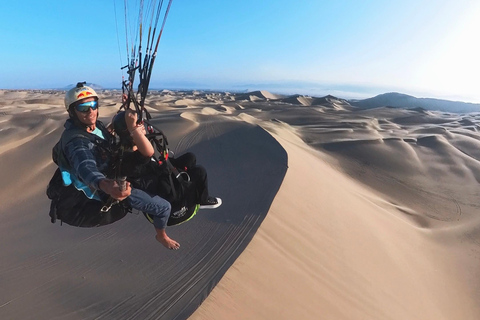 Paraglide over the desert and the Huacachina oasis