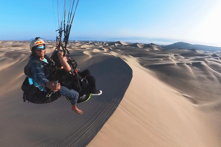Paraglide over the desert and the Huacachina oasis