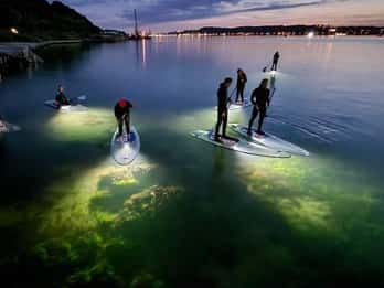 Kiel/Plön: glassSUP - guided night tour. Dive in without getting wet.