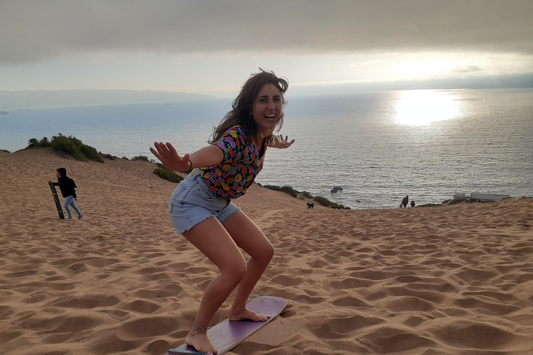 Sandboarding and sunset in Concon Sand dunes Sunset in Concon Sand dunes