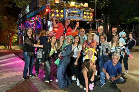 Medellín: Night City Tour on traditional Party Bus & Drinks Ruta Fresca