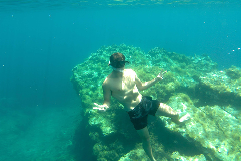 Paddelsurf i solnedgången, grottor, snorkling och cava