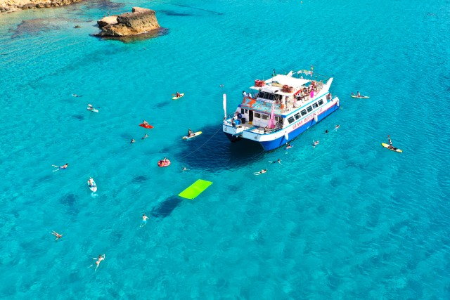 Visit Ibiza Beach Hopping Cruise w/ Paddleboard, Food, & Drinks in Santa Eulalia del Río, Ibiza