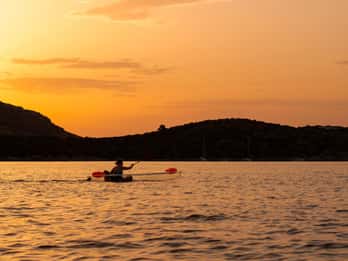 Golfo Aranci: transparent kayaks, sea views, dolphins, and aperitif