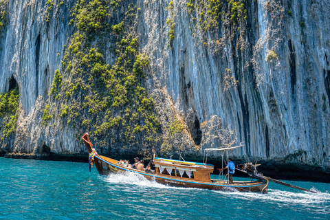 From Phi Phi: Iconic Bays by Longtail—Beach, Lagoon, Snorkel Phi Phi: Longtail Join Trip — Bays, Beach & Snorkeling