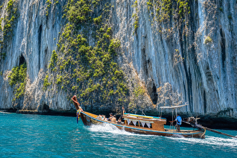 From Phi Phi: Iconic Bays by Longtail—Beach, Lagoon, Snorkel Phi Phi: Longtail Join Trip — Bays, Beach & Snorkeling