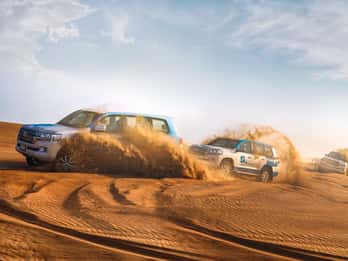 Abu Dhabi: Desert Safari with BBQ, Camel Ride & Sandboarding