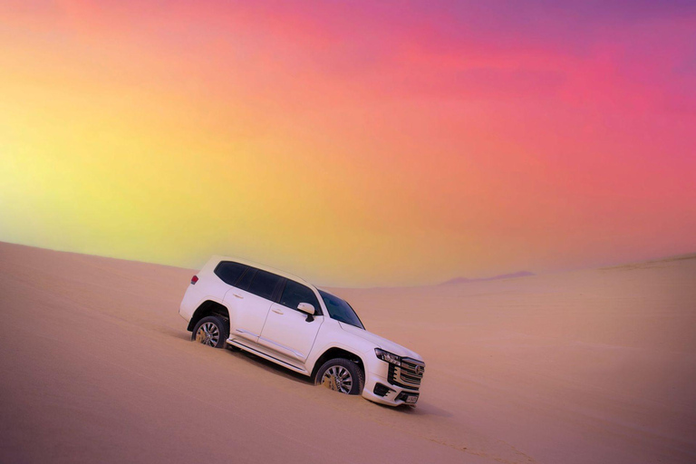 Doha: Arabic Costume, Desert Safari, Sandboarding & More Group Tour with Camel Ride in traditional Arabic Costume