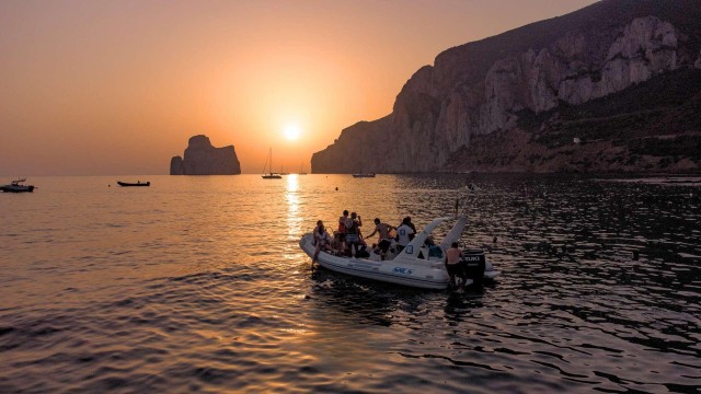 Visit From Cala Domestica Sunset boat tour to Porto Flavia in Punta Trettu, Sardinia