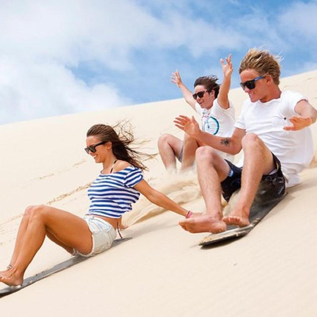 Sunset Desert Camel Ride with Sandboarding and BBQ Dinner