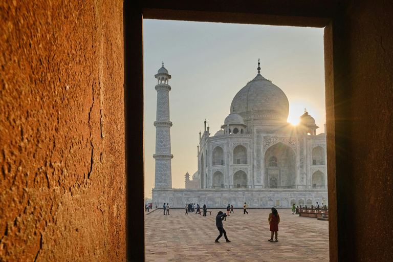 From Delhi: Sunrise Taj Mahal & Agra Fort Day Trip by AC Car Tour Guide Services Only